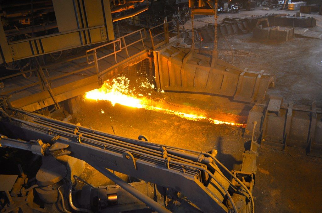 Molten iron pouring from a blast furnace